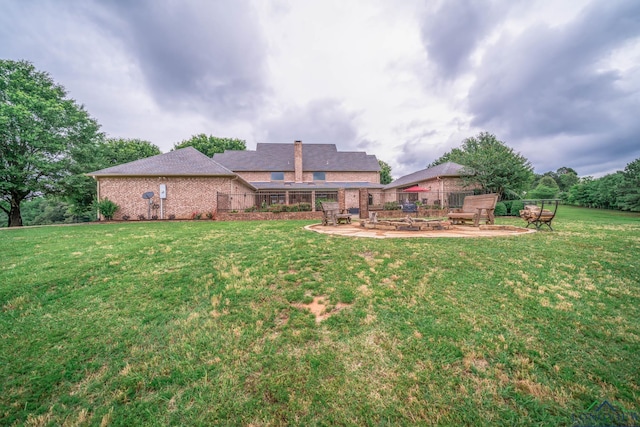 335 Winding Way, Hallsville, TX 75650 - rear view of property featuring a patio and brick siding