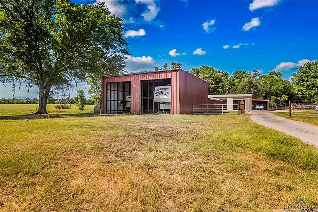 view of outbuilding featuring a yard