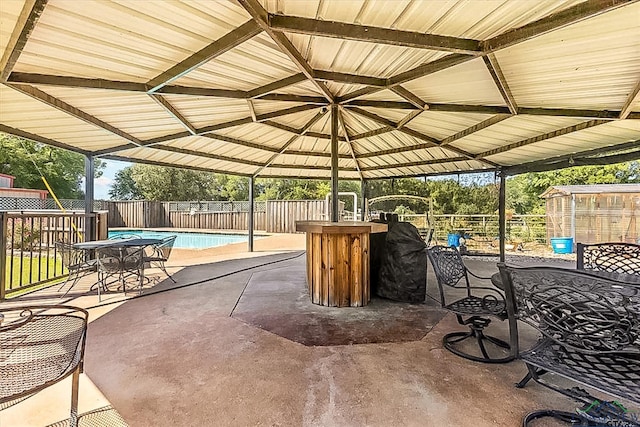 view of patio with a fenced in pool