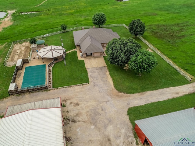 birds eye view of property with a rural view