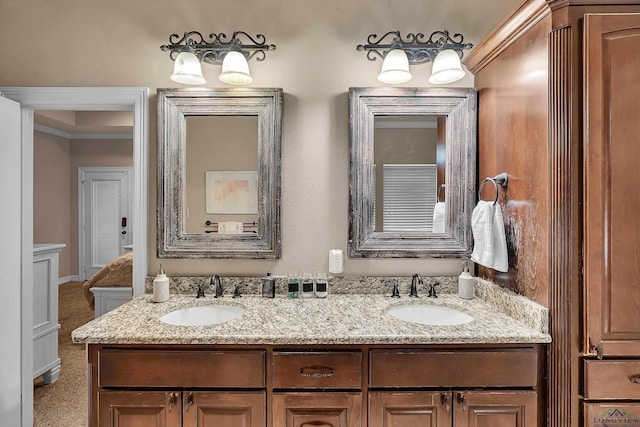 bathroom featuring vanity and crown molding