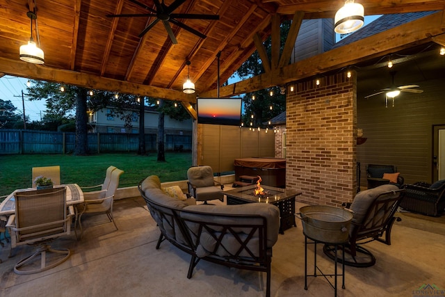 view of patio with ceiling fan and an outdoor living space with a fire pit