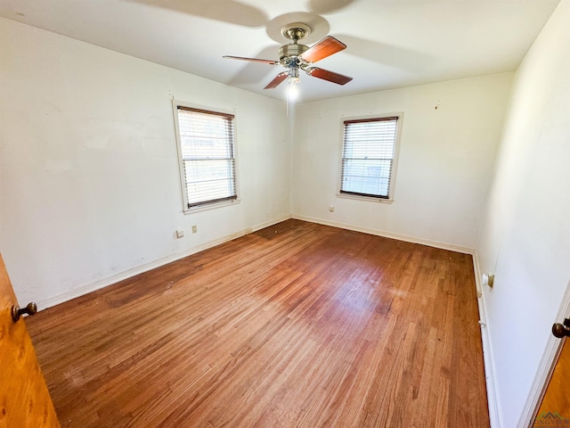 215 Oxford Ln, Longview, TX 75601 - spare room featuring plenty of natural light, a ceiling fan, and light wood-style floors