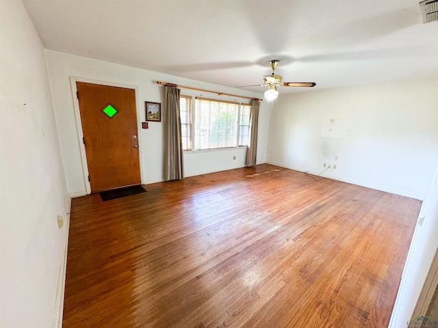 interior space with hardwood / wood-style flooring and ceiling fan