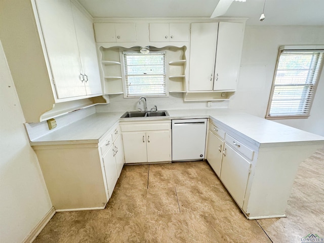 215 Oxford Ln, Longview, TX 75601 - kitchen featuring open shelves, dishwasher, a peninsula, light countertops, and plenty of natural light