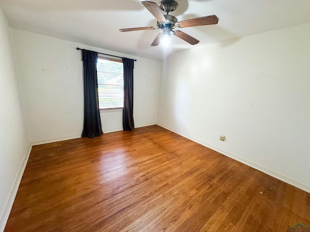 unfurnished room featuring ceiling fan and wood-type flooring