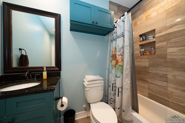 bathroom featuring toilet, shower / bath combination with curtain, vanity, and baseboards