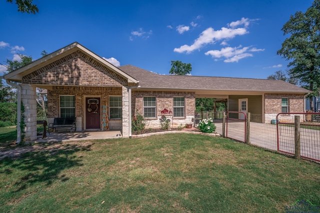 ranch-style house with brick siding, fence, a front lawn, and a patio