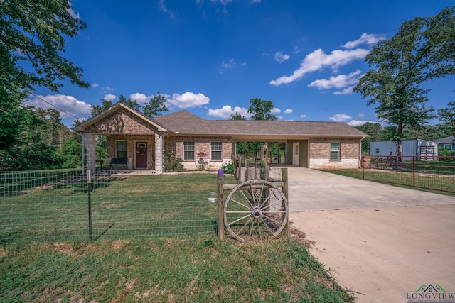 single story home featuring brick siding, fence, an attached carport, driveway, and a front lawn