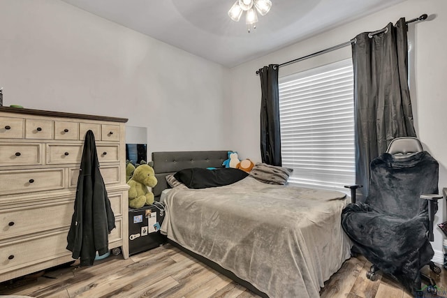 bedroom with light wood-type flooring and ceiling fan