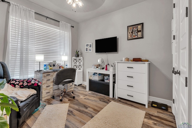 office area featuring light hardwood / wood-style floors and ceiling fan