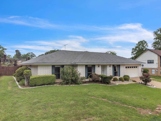 ranch-style house featuring fence, concrete driveway, an attached garage, brick siding, and a front yard