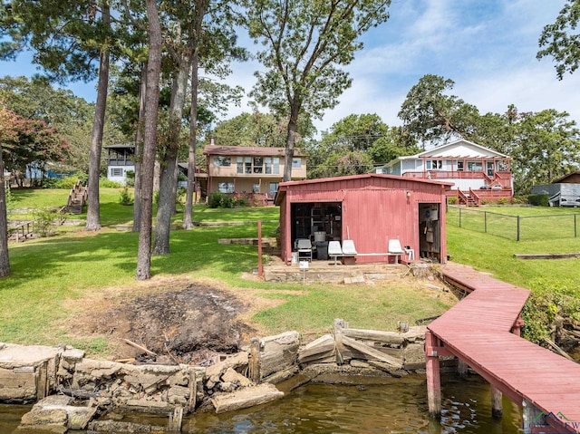 dock area featuring a yard and a water view