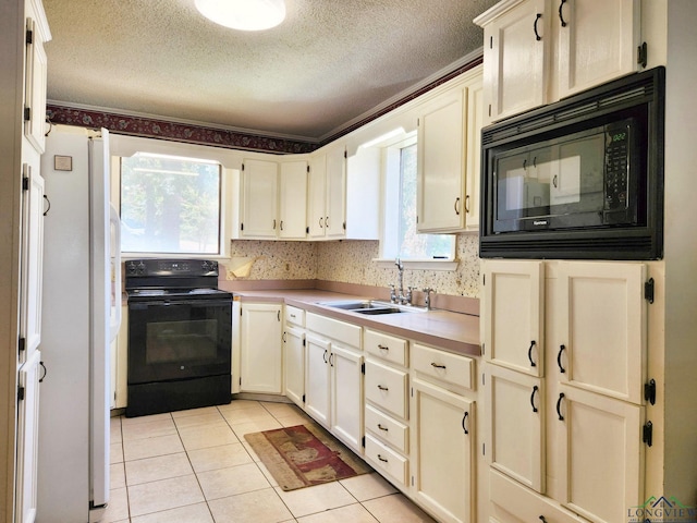 kitchen featuring black appliances, sink, ornamental molding, a textured ceiling, and light tile patterned flooring