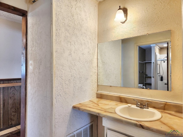 bathroom featuring vanity and walk in shower