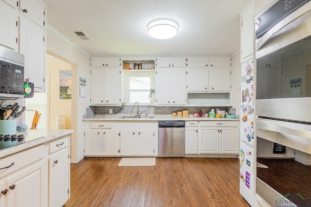 kitchen featuring a sink, appliances with stainless steel finishes, open shelves, and light wood-style floors