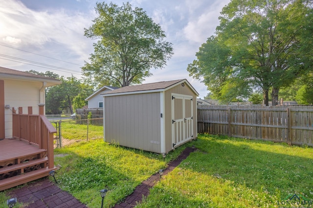 view of shed featuring a fenced backyard