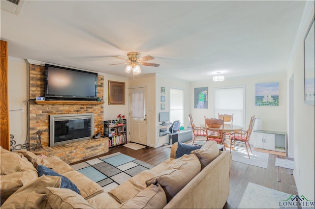 500 Jasper Dr, Marshall, TX 75672 - living room with visible vents, ornamental molding, ceiling fan, and wood finished floors