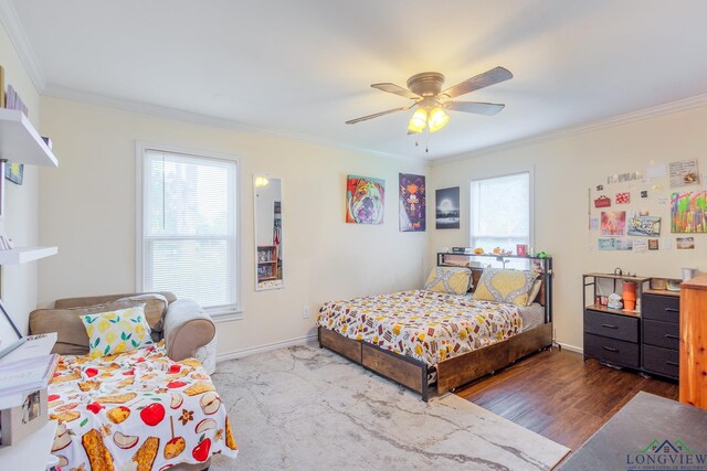500 Jasper Dr, Marshall, TX 75672 - bedroom with crown molding, baseboards, wood finished floors, and multiple windows