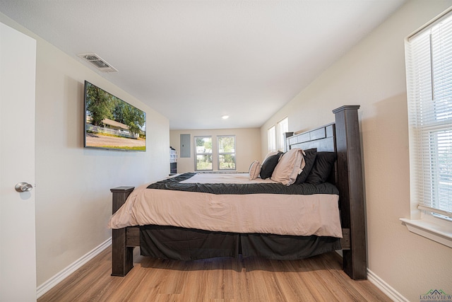 bedroom with hardwood / wood-style flooring