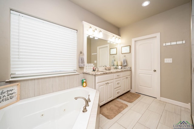 full bathroom with a whirlpool tub, recessed lighting, baseboards, and vanity