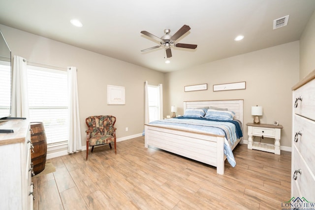 bedroom with recessed lighting, a ceiling fan, baseboards, visible vents, and light wood finished floors