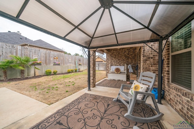 view of patio / terrace with a gazebo and a fenced backyard