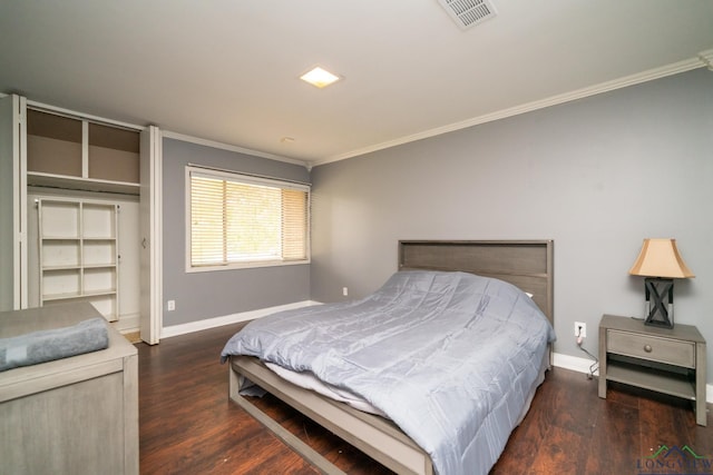 bedroom featuring dark hardwood / wood-style floors and ornamental molding