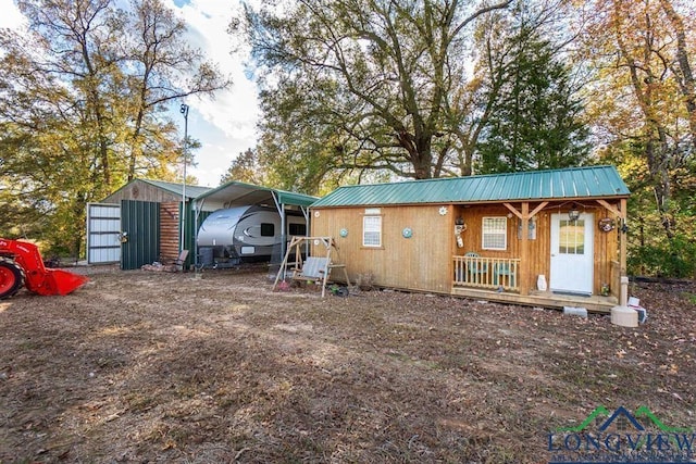 exterior space featuring a carport