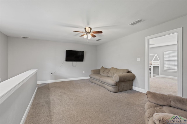 223 Circle Ridge Dr, Gilmer, TX 75645 - carpeted living room with a ceiling fan and baseboards