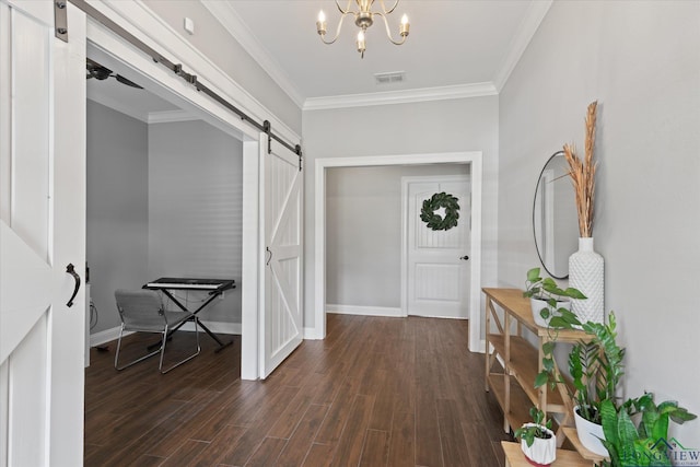 223 Circle Ridge Dr, Gilmer, TX 75645 - entryway featuring a barn door, a chandelier, crown molding, dark wood finished floors, and baseboards