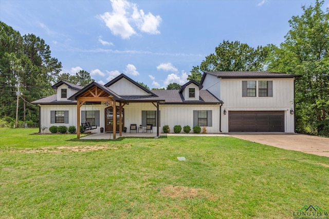 223 Circle Ridge Dr, Gilmer, TX 75645 - modern inspired farmhouse with a garage, driveway, a front lawn, and board and batten siding