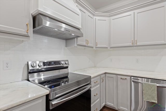 223 Circle Ridge Dr, Gilmer, TX 75645 - kitchen featuring stainless steel appliances, wall chimney range hood, decorative backsplash, crown molding, and light stone countertops