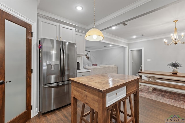 223 Circle Ridge Dr, Gilmer, TX 75645 - kitchen featuring stainless steel refrigerator with ice dispenser, butcher block counters, dark wood finished floors, recessed lighting, and crown molding