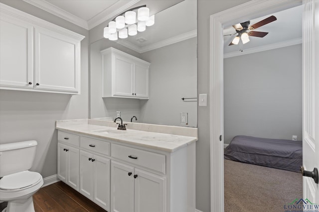 223 Circle Ridge Dr, Gilmer, TX 75645 - bathroom with vanity, ceiling fan, toilet, baseboards, and crown molding