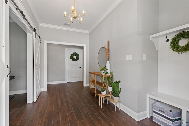 223 Circle Ridge Dr, Gilmer, TX 75645 - entryway with a barn door, a chandelier, baseboards, and crown molding