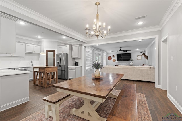 223 Circle Ridge Dr, Gilmer, TX 75645 - dining area with dark wood finished floors, ceiling fan, crown molding, recessed lighting, and a chandelier