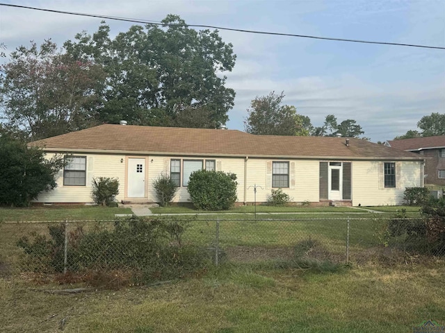 ranch-style home with a front lawn