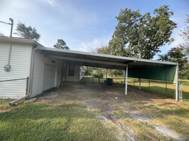 view of car parking with a lawn, a garage, and a carport