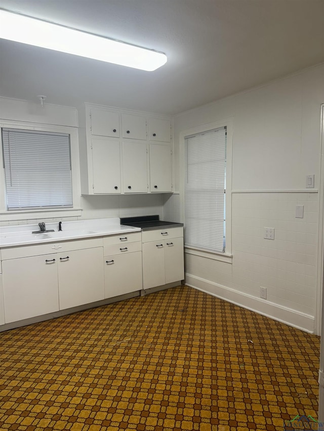 kitchen with sink and white cabinets