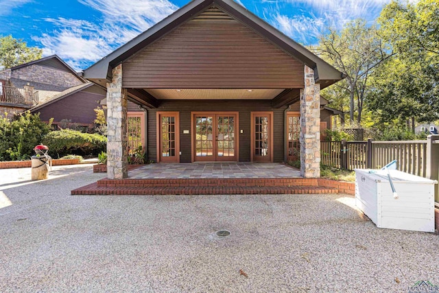 property entrance with french doors and a patio area