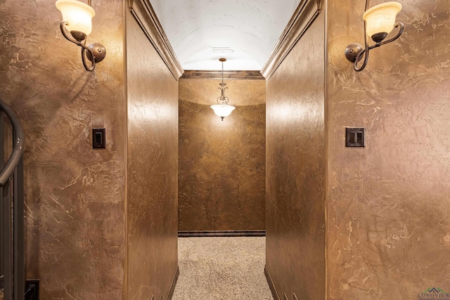 corridor featuring crown molding and carpet flooring