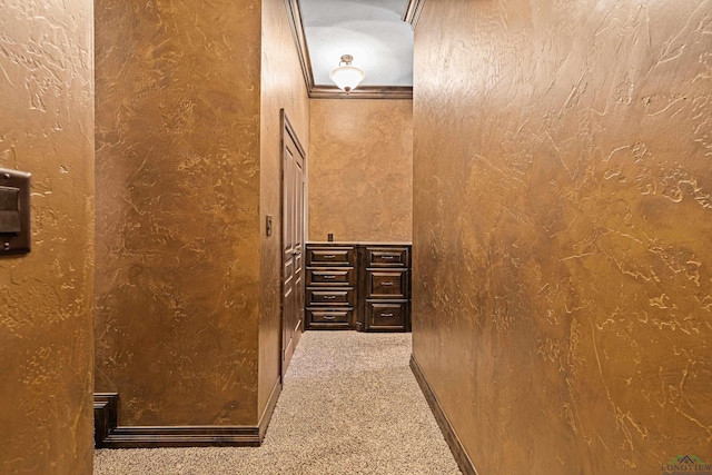 interior space featuring a textured wall and carpet floors