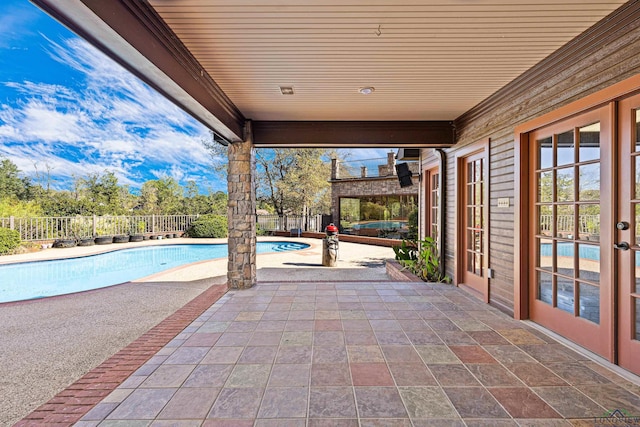 view of patio / terrace with fence and a fenced in pool