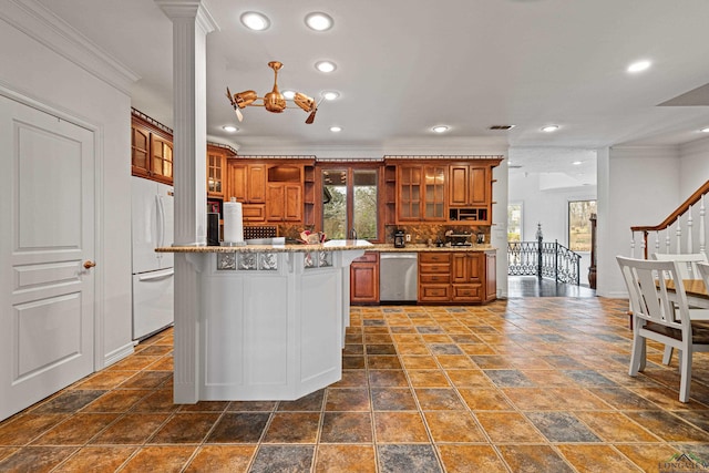 kitchen with dishwasher, glass insert cabinets, brown cabinets, freestanding refrigerator, and a center island