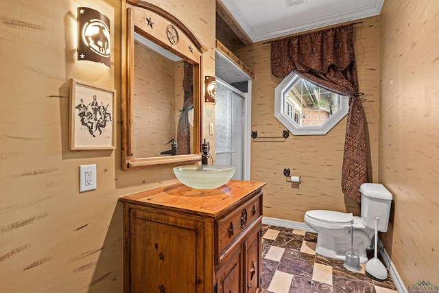 bathroom featuring toilet, vanity, baseboards, wallpapered walls, and crown molding