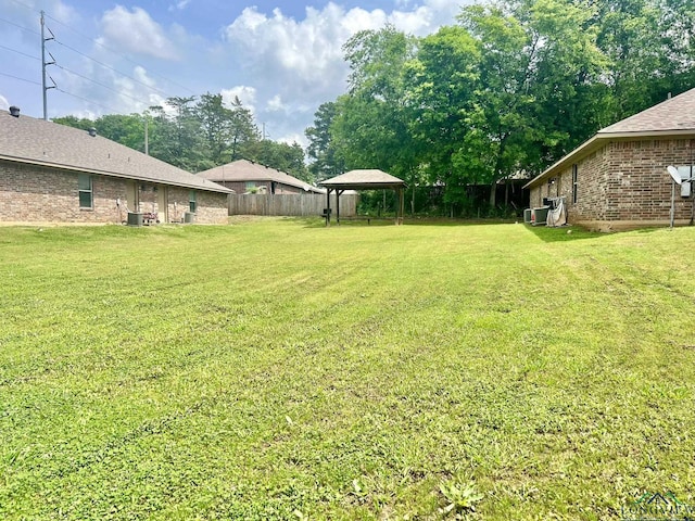 view of yard with a gazebo and cooling unit