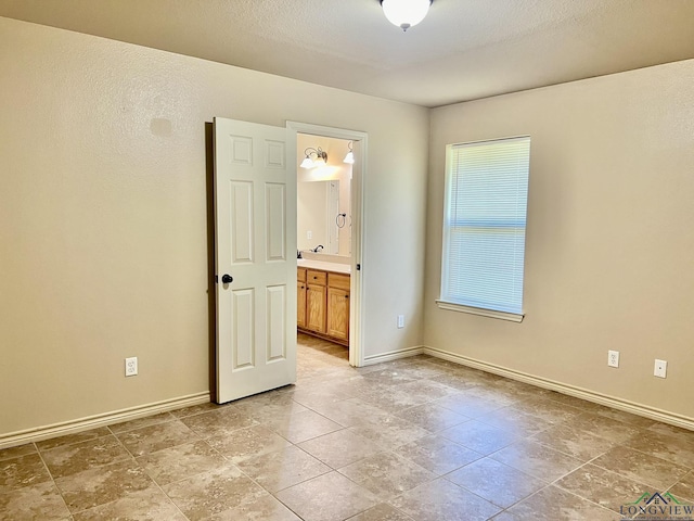 unfurnished room with sink