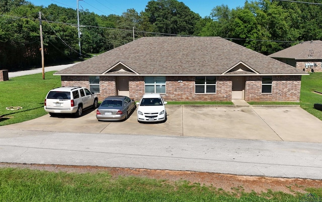 view of front of property with a front lawn