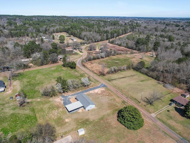 birds eye view of property with a rural view